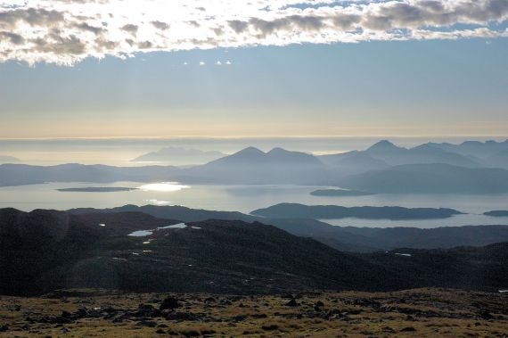 The car park at the top of the Bealach na Ba is 2,053 feet above sea level. From there can be seen dramatic views of Raasay and the Isle of Skye.